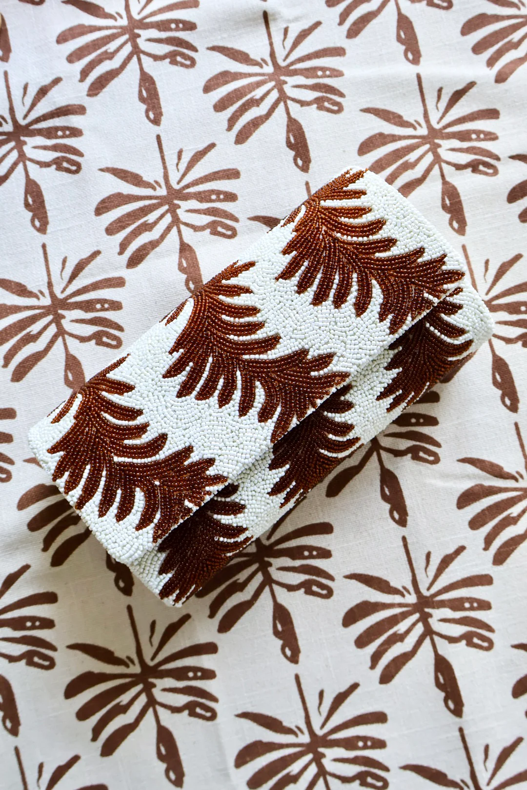 brown & white palmette beaded clutch